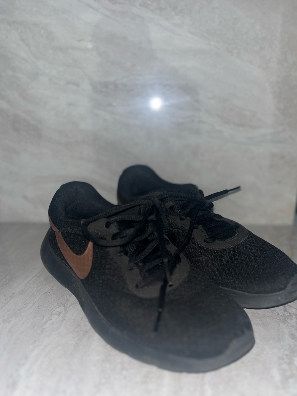 Nike Black Sneakers with Brown Swoosh Accent